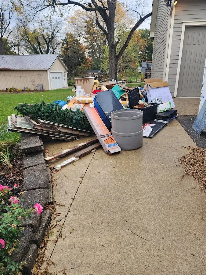 Dumpster being loaded with debris for 30 Yard Dumpster Rental in Wekiwa Springs
